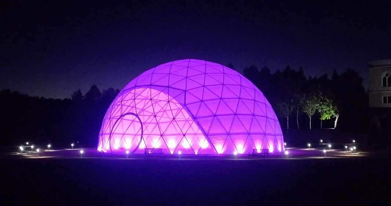 A purple dome with lights on top of it.