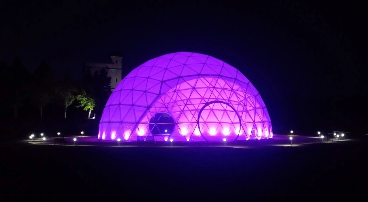 A purple dome with lights on top of it.