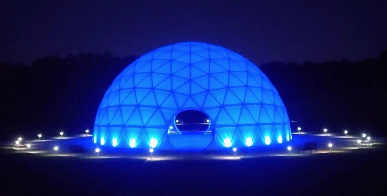 A blue dome with lights on top of it.
