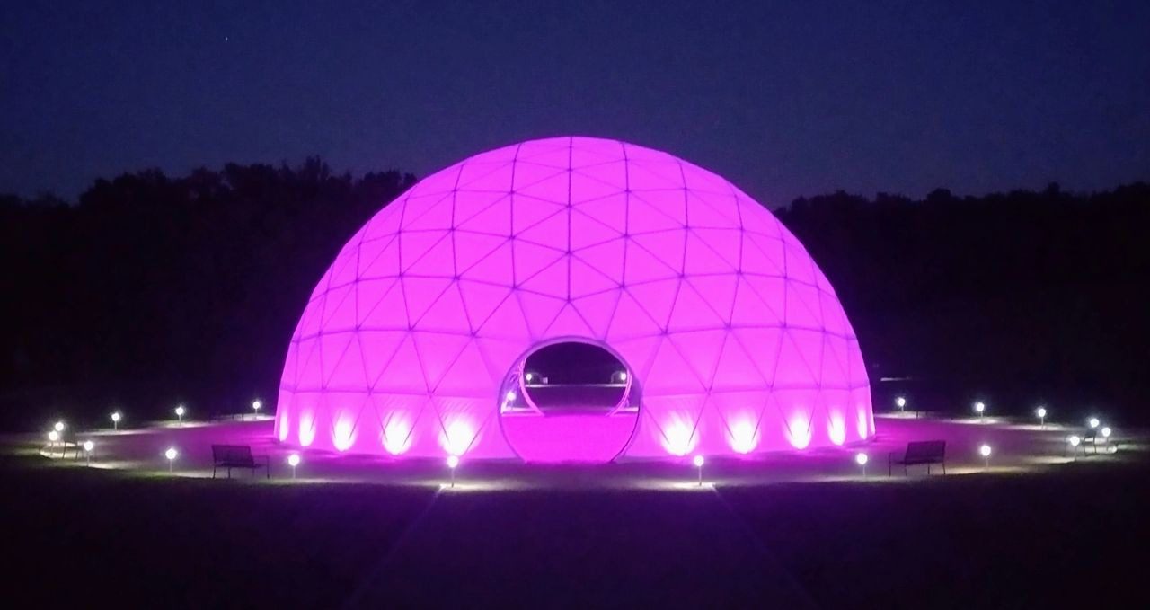 A large purple dome with lights on top of it.