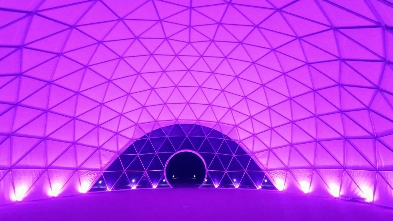 A purple dome with lights on the ceiling.