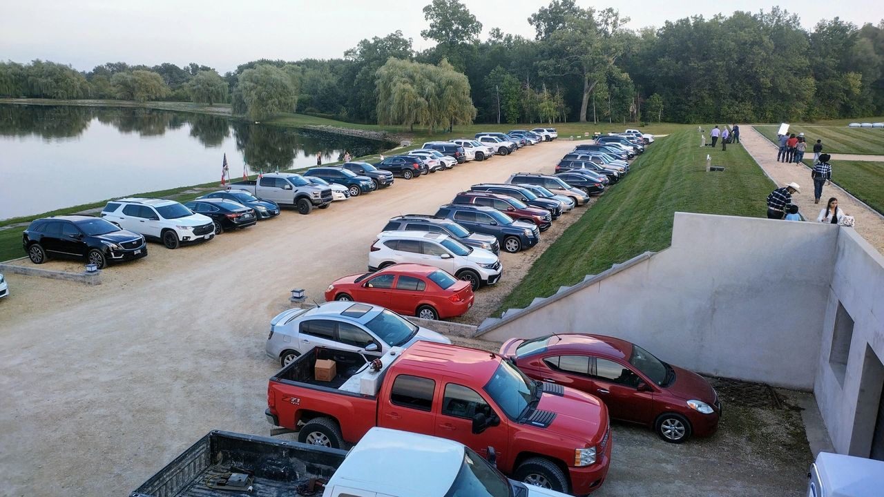 A lot of cars parked in the parking lot