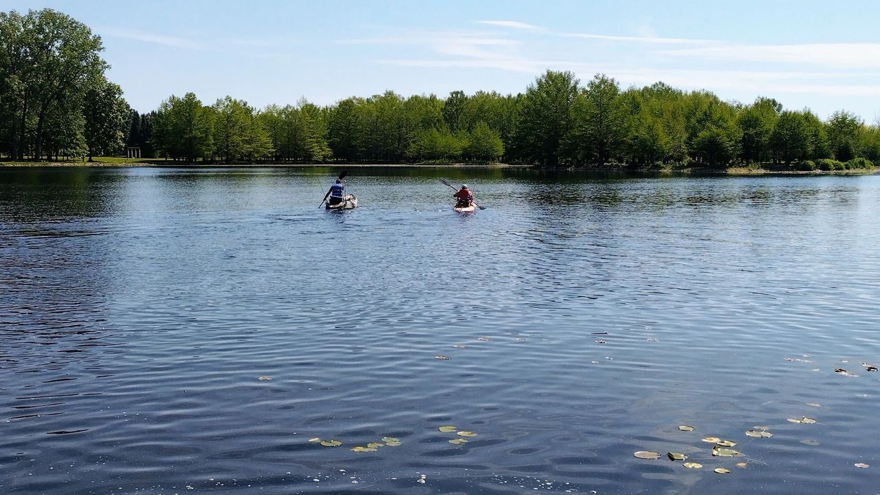Two people in a canoe on the water.