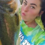 A woman with her mouth open looking at the camera.